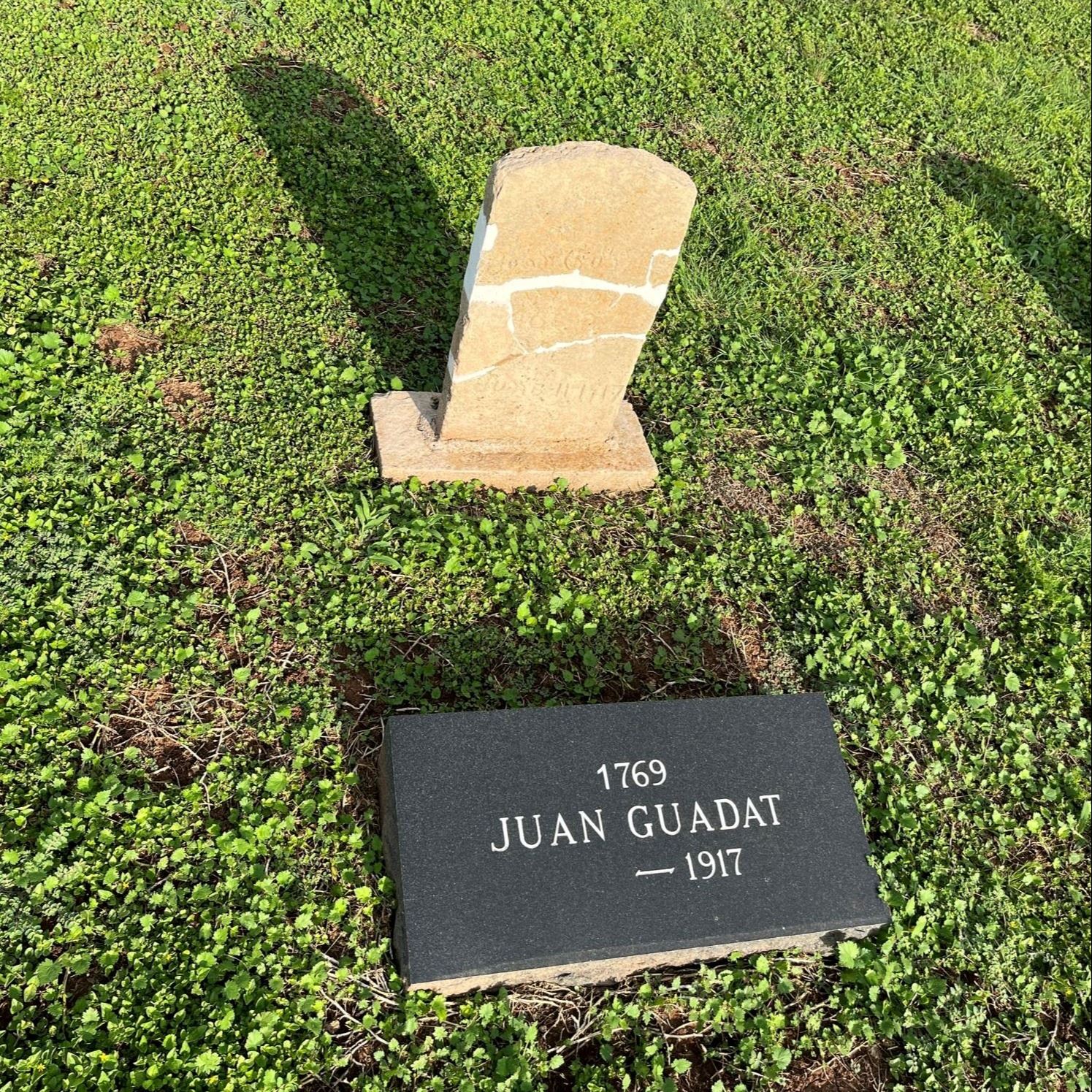 Post-Restoration of Juan Guadat's gravestone and pillow marker in 2023