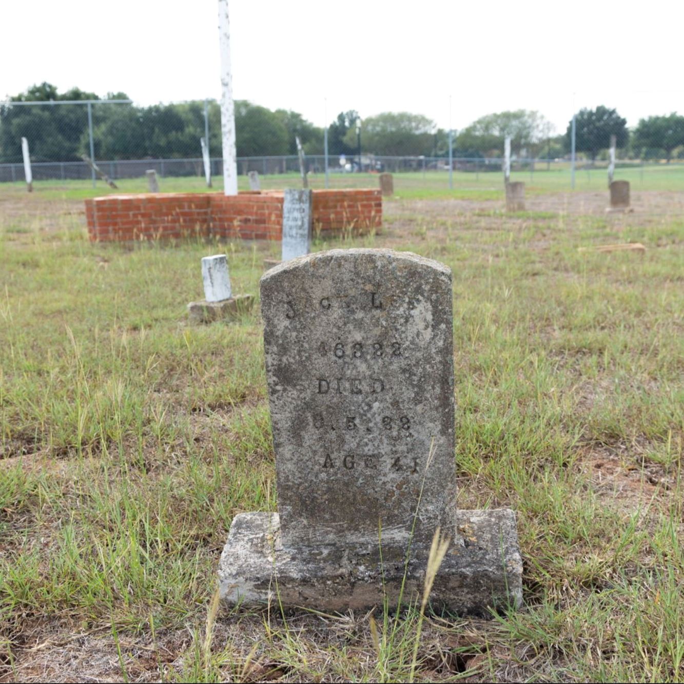 Pre-Restoration of Jack Lee's gravestone in 2023