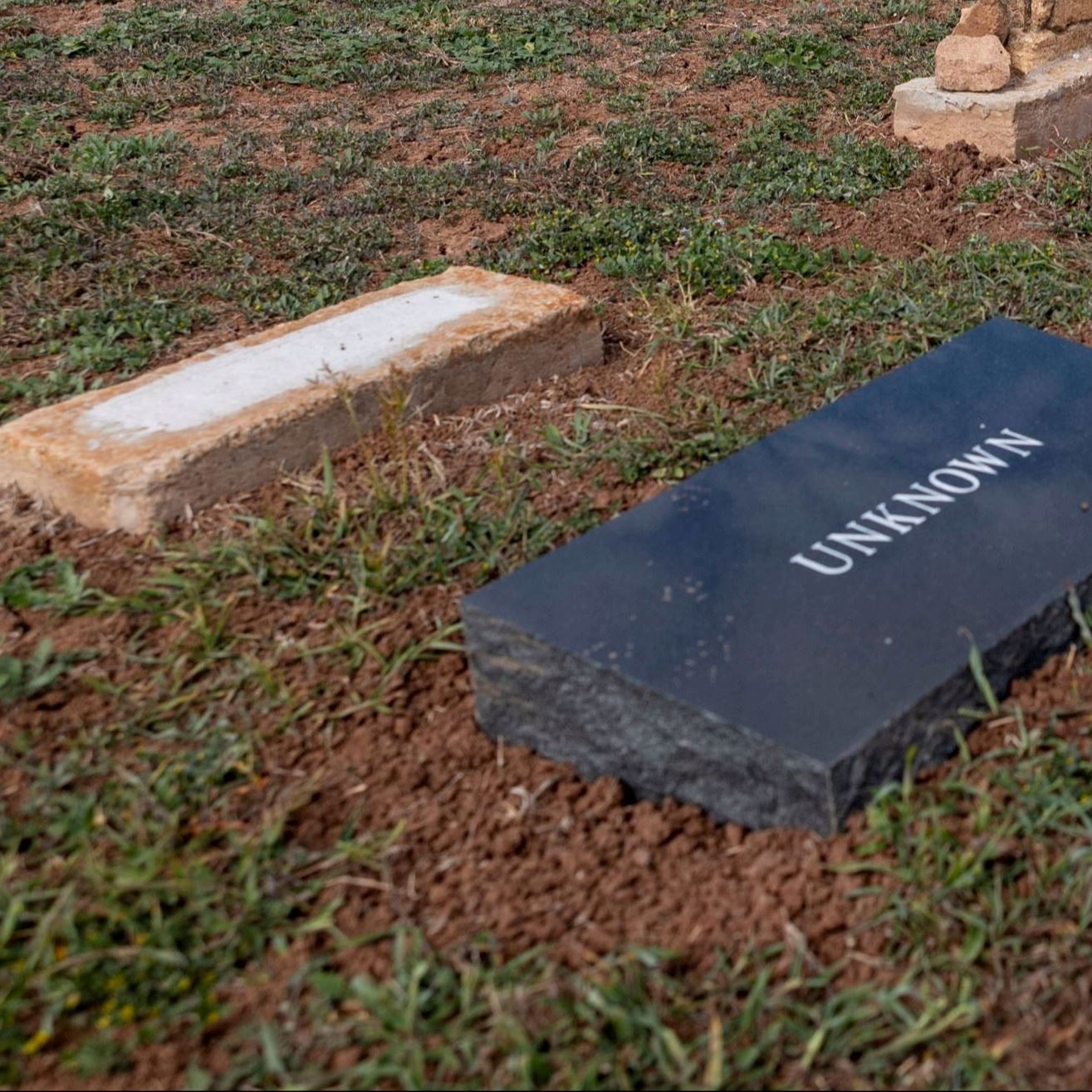 Post-Restoration of Unknown (Grave 31) gravestone and pillow marker in 2023